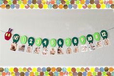 a number line with pictures hanging from it's sides in front of confetti circles