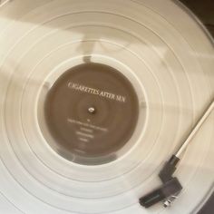 an old record player is spinning on its turntable with the words ommetetartron printed on it