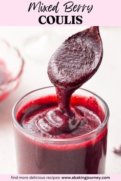 a spoon full of red liquid with the words mixed berry coulis above it