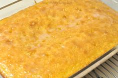 a baking pan filled with food on top of a metal rack