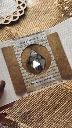 a piece of paper that is on top of some burlap and has an image of a diamond in it