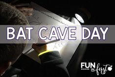 a boy writing on a piece of paper with the words bat cave day written below it