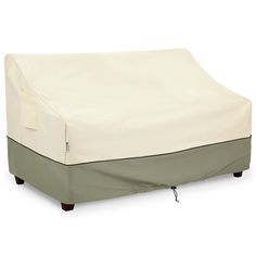 an outdoor furniture cover on top of a couch