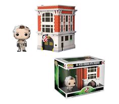 two pop vinyls are shown in front of a building and one has an open door