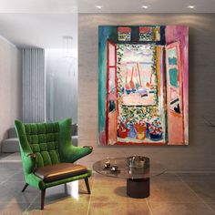 a green chair sitting in front of a painting on the wall next to a glass table