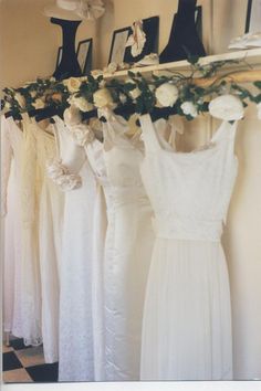 there are many dresses hanging on the rack