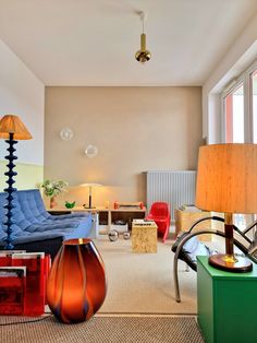 a living room filled with furniture and lamps