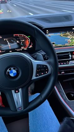 the interior of a car with dashboard, steering wheel and electronic display on the screen