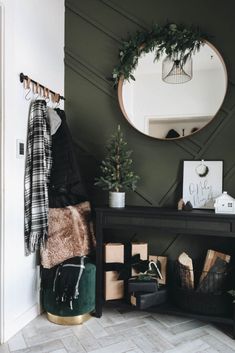 a room with a mirror, coat rack and other items