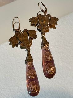 Vintage Czech Art Nouveau Earrings Circa 1920-1930's from the Czech Republic.  This vintage piece is made with brass and Czech glass which is cast into molds and fashioned into pieces of jewelry.  The pieces I have listed for sale have natural wear from time as they are not reproductions.   The earrings measure 5 inches and weighs .7 oz. each (with a lever back closure measuring 3/4 inch). Thank you for looking! Victorian Gold Plug Earrings, Vintage Ceremonial Drop Earrings, Vintage Drop Earrings For Ceremonial Occasion, Victorian Brass Earrings For Ceremonial Use, Victorian Brass Earrings For Ceremonial Occasions, Antique Dangle Earrings From Vintage Collection, Antique Dangle Earrings For Vintage Collection, Antique Finish Brass Drop Earrings, Antique Brass Drop Plug Earrings