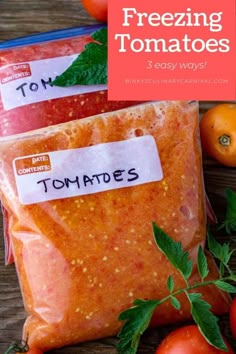 two bags of frozen tomatoes sitting on top of a wooden table next to other vegetables