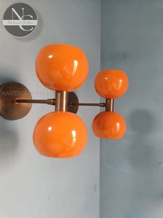 an orange light fixture hanging from the ceiling