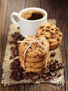 cookies and coffee on a table with burlap