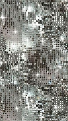 an abstract mosaic pattern with silver and black squares on the side, as well as white dots