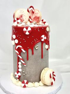 a red and white cake decorated with candy canes