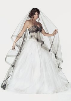 a woman wearing a wedding dress and veil