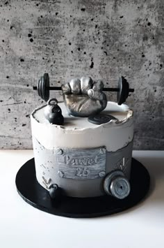 there is a cake that has been decorated to look like a bodybuilding machine