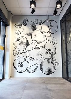 an apple mural on the side of a building