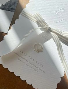 the wedding stationery is laid out on top of each other