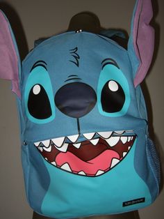 Officially Licensed Disney Backpack NEW LILO & STITCH BACKPACK Canvas backpack from Disney's Lilo & Stitch with a Stitch character face design featuring attached faux leather teeth and attached ears on top. Front zip pocket for additional storage. Interior laptop sleeve. Padded back & adjustable straps. Zipper closure. Bag measures 16" X 12" X 5" Sully Onesie, Cute Jordans, Disney Room Decor, Lilo And Stitch Quotes, Stitch Backpack, Stitch Character, Stitch Quote, Alien Character, Stitch Clothes