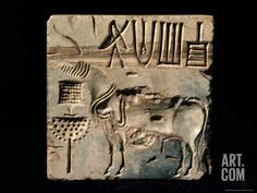 an ancient bask depicting animals and people on it's side, with the word xauille written in cursive writing