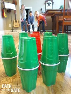 children playing with plastic cups on the floor