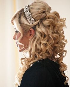 a woman with long blonde hair wearing a tiara