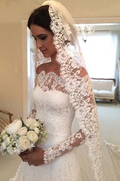 a woman in a wedding dress holding a bouquet