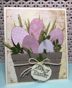 an easter card with eggs in a basket on the front and happy easter tag on the back