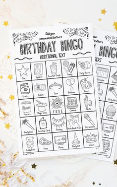 two printable birthday bingo game cards on top of a table with confetti