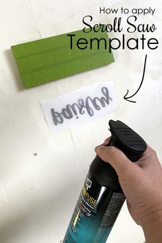 a hand holding a spray bottle with the words how to apply scroll saw template on it