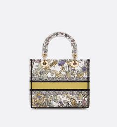 The Lady D-Lite bag combines classic elegance with House modernity. The latte style is fully embroidered with the yellow multicolor Dior Chardons motif by Pietro Ruffo, showcasing the national flower of Scotland, which symbolizes protection, resilience and freedom. A Christian Dior Paris signature adorns the front, while D.I.O.R. charms in pale gold-finish metal enhance and illuminate its silhouette. Featuring a wide, removable embroidered strap, the medium Lady D-Lite bag can be carried by hand Lady D Lite Bag, Scotland National Flower, Flower Of Scotland, Christian Dior Paris, Dior Paris, National Flower, Lady D, Wallet Pouch, Gift Newborn