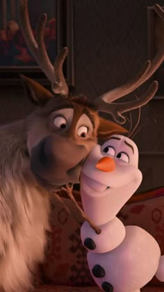 an animated character is kissing another character with antlers on his head in a scene from disney's frozen princess