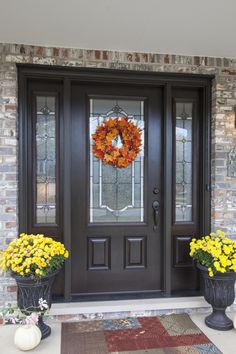 the front door is decorated with yellow flowers