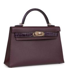 This Kelly, in the Sellier style, is in Cassis and Amethyst Madame leather and Shiny Alligator with permabrass hardware and has tonal stitching, two front straps with front toggle closure, single rolled handle and removable shoulder strap.The interior is lined with Cassis lambskin and has one open pocket on the back wall.Collection: BOrigin: FranceCondition: Pristine; new or never worn (plastic on hardware)Accompanied by: Hermès box, Hermès dustbag, shoulder strap, shoulder strap dustbag, felt, Dream Items, Mini Kelly, Hermes Box, Hermes Bags, Luxury Handbags, Alligator, Luxury Bags, Dust Bag, Fendi