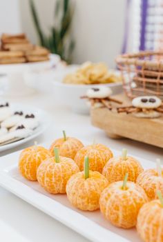 there are many oranges on the table ready to be cut and served for guests