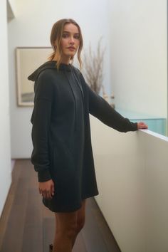 A person stands in a hallway wearing the ETTA HOODIE DRESS from Velvet by Graham & Spencer Fitted Sweatshirt Dress, Hoodie Dress Outfit, Velvet Tees, Cami Shirt, Workout Sweatshirt, Romper Dress, Sweater Sale, Cotton Fleece, Sweatshirt Dress