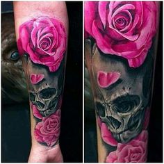 a skull and pink roses tattoo on the arm