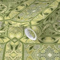 a green and yellow wallpaper with an intricate design on it's surface,