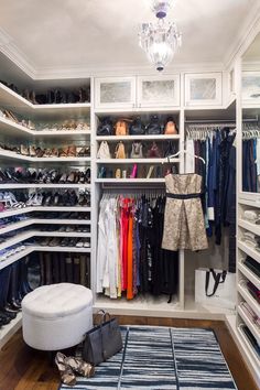 an organized closet with white shelving and lots of shoes on the shelves, including one woman's purse