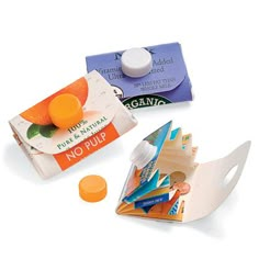 an assortment of different items on a white surface with one orange and the other two