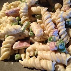 pasta with peas, ham and cream sauce in a bowl