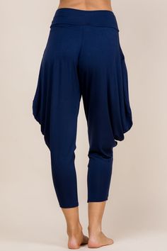 Kooniez are the most comfortable and versatile pants you'll ever wear. Perfect for going to work, heading to your next yoga class, or lounging at home. Comfortable Yoga Pants With Loosely Fitted Hips For Relaxation, Casual Pants With Elastic Waistband For Pilates, Versatile Blue Yoga Pants, Comfort Stretch Pants For Yoga, Versatile Yoga Pants With Pockets For Loungewear, Comfortable Yoga Pants With Comfort Stretch, Navy Stretch Activewear For Loungewear, Stretch Solid Color Harem Yoga Pants, Blue Relaxed Fit Yoga Pants For Loungewear