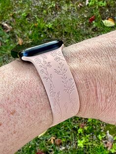 Upgrade your Apple Watch with our Wildflower Women's Silicone Band for Series 9 & and earlier models. Personalized, durable, and stylish, it's the perfect laser-engraved gift for her. Fits 38/40/41/42/44/45/49mm. Embrace the charm of nature right on your wrist with the Wildflower Women's Silicone Watch Band, now fully compatible with the brand new Apple Watch Series 9 and all previous models. This band's exquisite, laser-engraved wildflower design is perfect for those who adore the delicate touc Floral Watches, Wildflower Design, New Apple Watch, Silicone Watch Band, Customizable Gifts, Stocking Stuffer Gifts, Silicon Bands, Apple Watch Band, Apple Watch Series