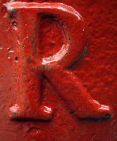 the letter r is painted red and it appears to be frosted with icing