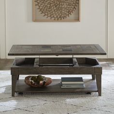 a coffee table with an open shelf underneath it