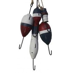 three buoys hanging from hooks in the shape of an american flag boat ornament