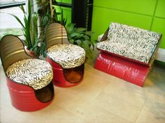 three red and brown chairs sitting next to each other in front of a green wall