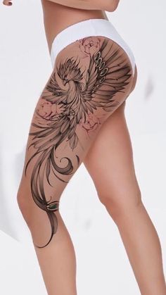 a woman with tattoos on her legs and thighs