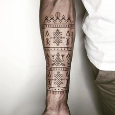 a man with a tattoo on his arm